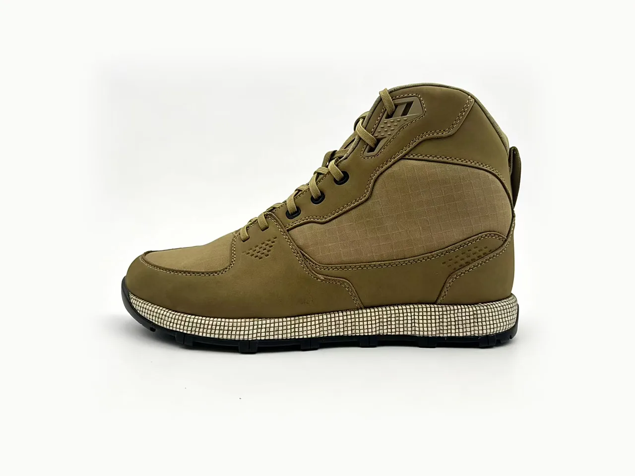 Tan waterproof hiking boot with lugged outsole